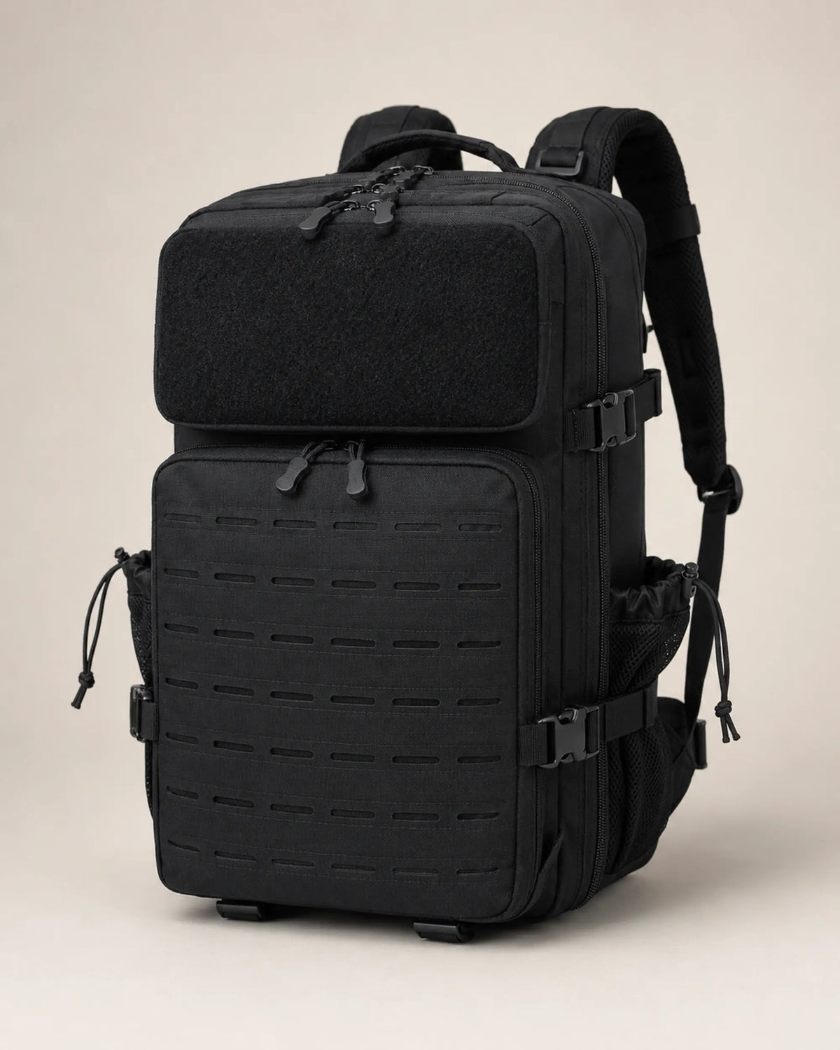 Black water-resistant laser-cut MOLLE tactical backpack in a front three-quarter studio view