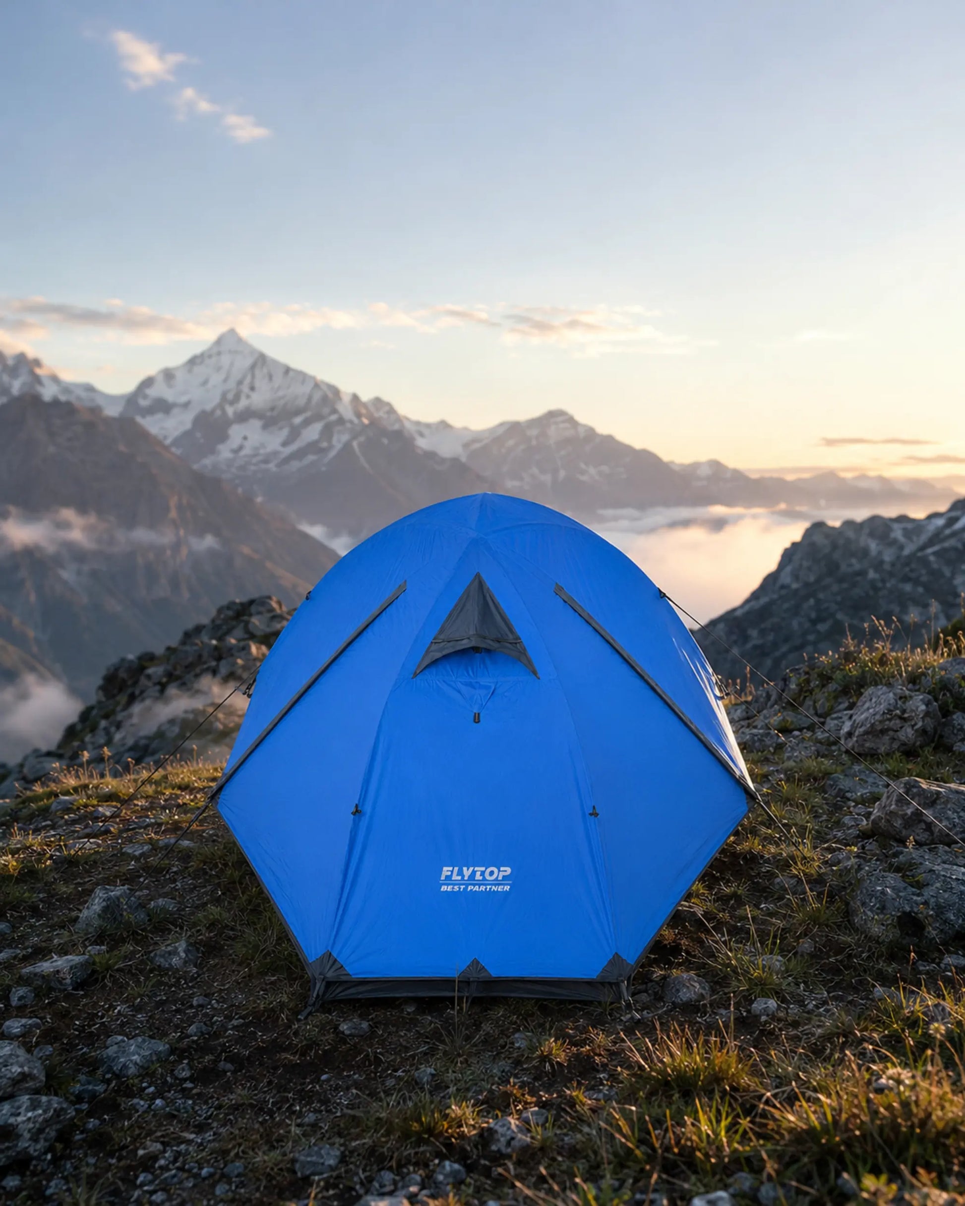 FLYTOP blue two-person waterproof tent pitched at an alpine campsite