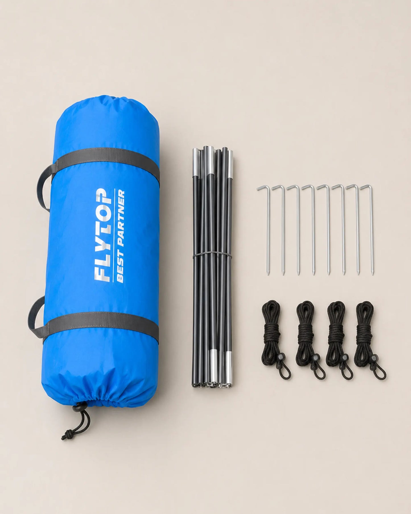 FLYTOP blue camping tent packed with poles, stakes and guy lines