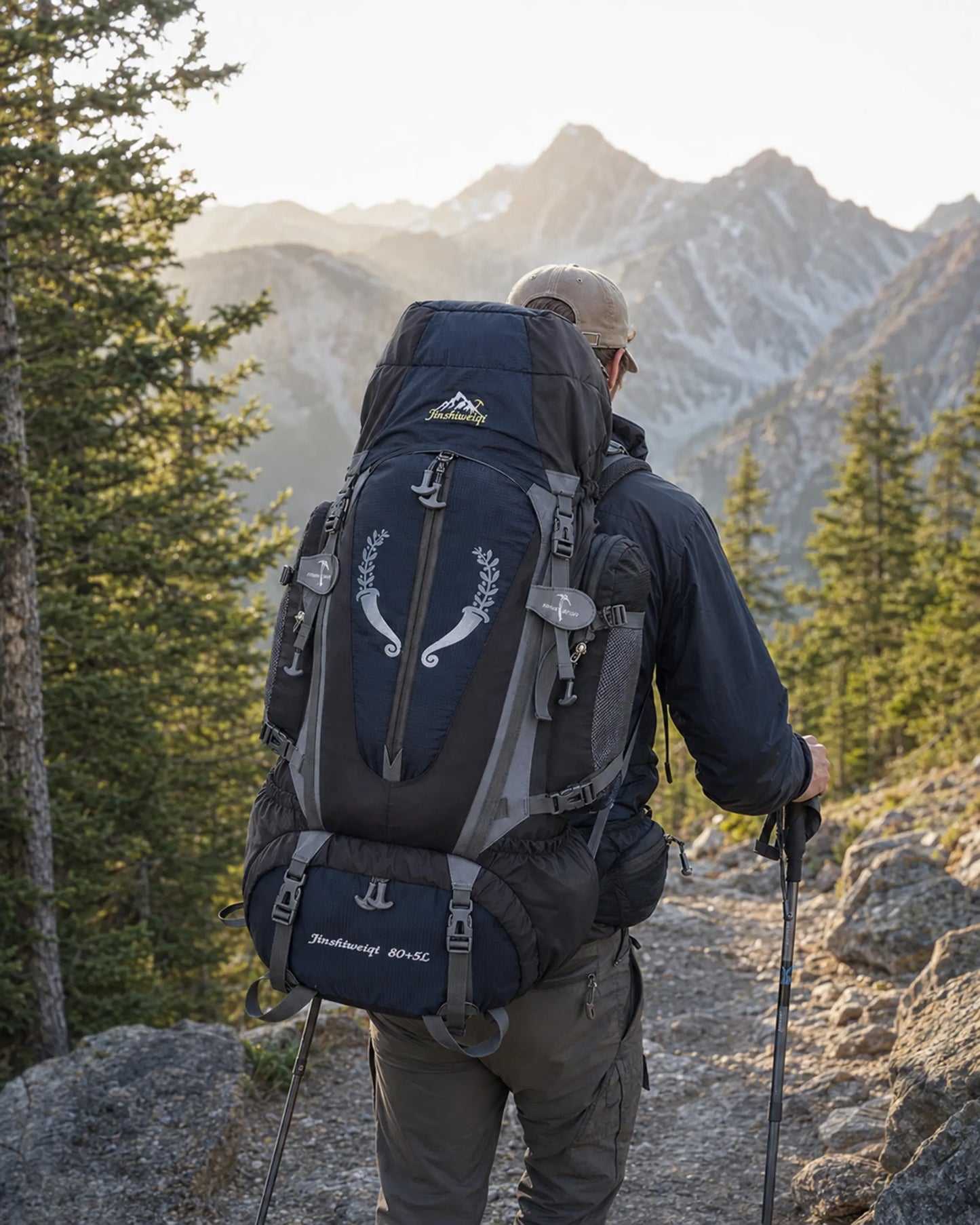 Hiker wearing a black Jinshiweiqi large-capacity backpack on an alpine trail