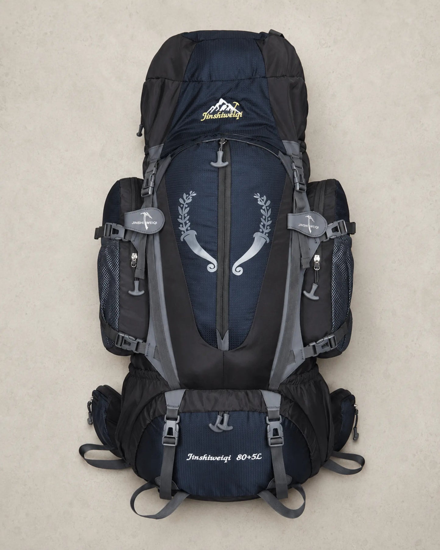 Black Jinshiweiqi large-capacity hiking backpack arranged in a premium flat lay