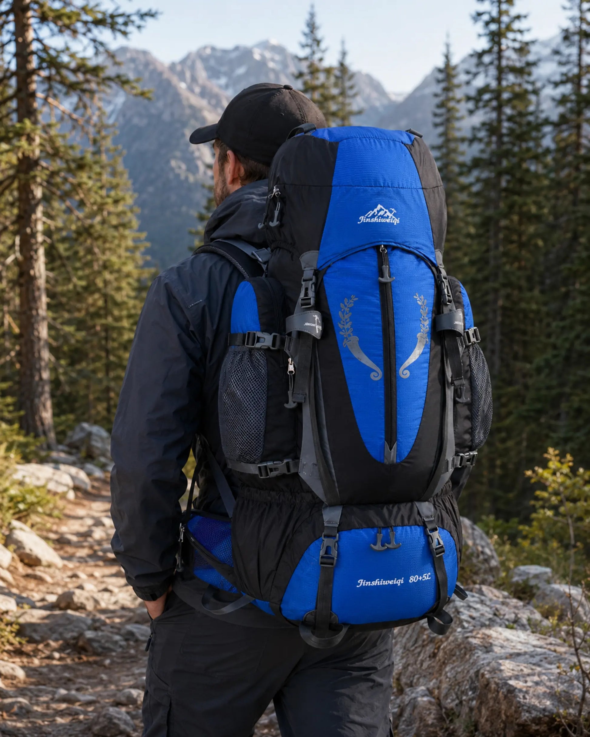 Hiker wearing a blue Jinshiweiqi large-capacity backpack on a mountain trail