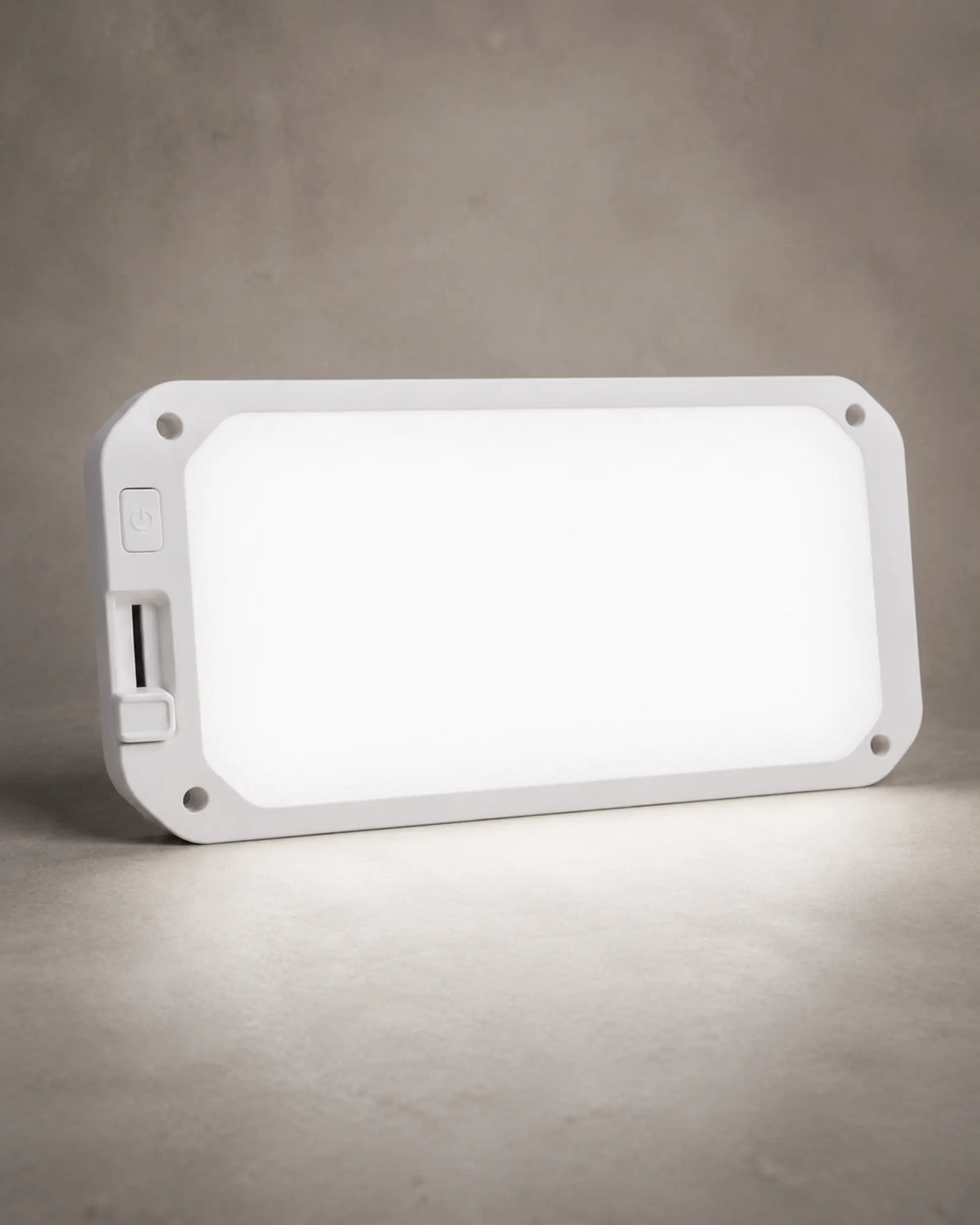 Neutral white dimmable RV ceiling light illuminated in a clean studio setting