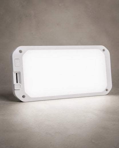 Neutral white dimmable RV ceiling light illuminated in a clean studio setting