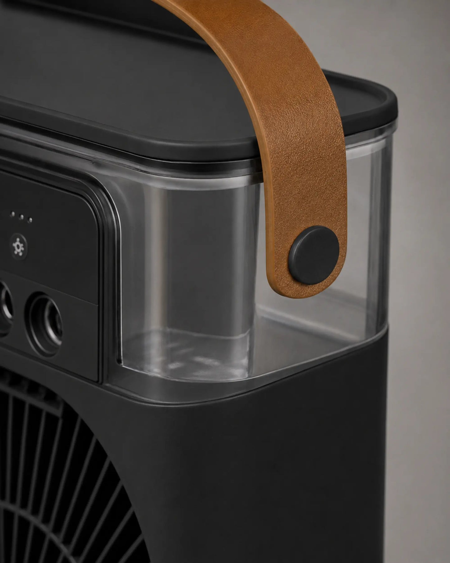 Close-up of the tan carry handle and clear tank on the OIMG black mist fan