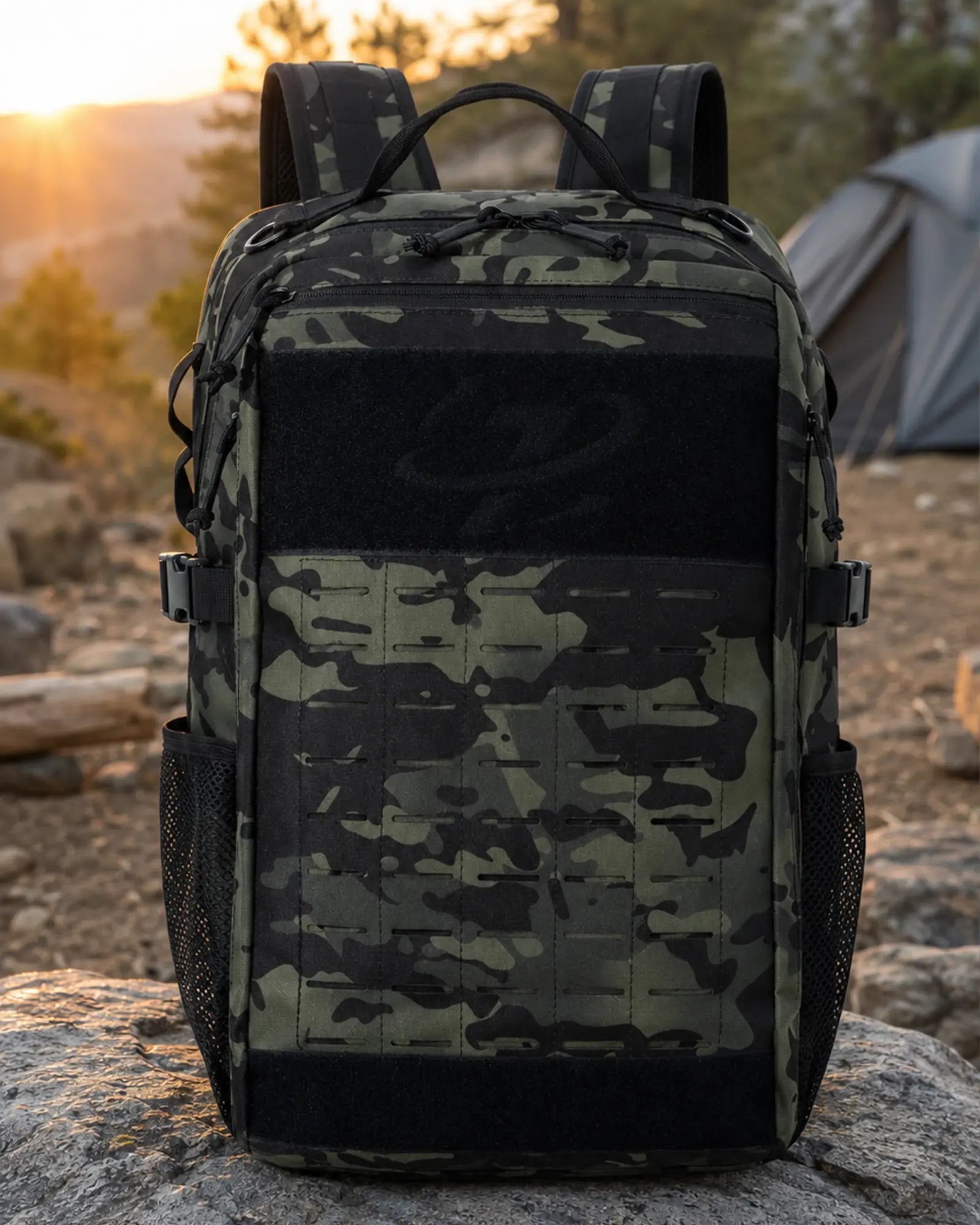 Black camo Scione MOLLE tactical backpack at a mountain campsite