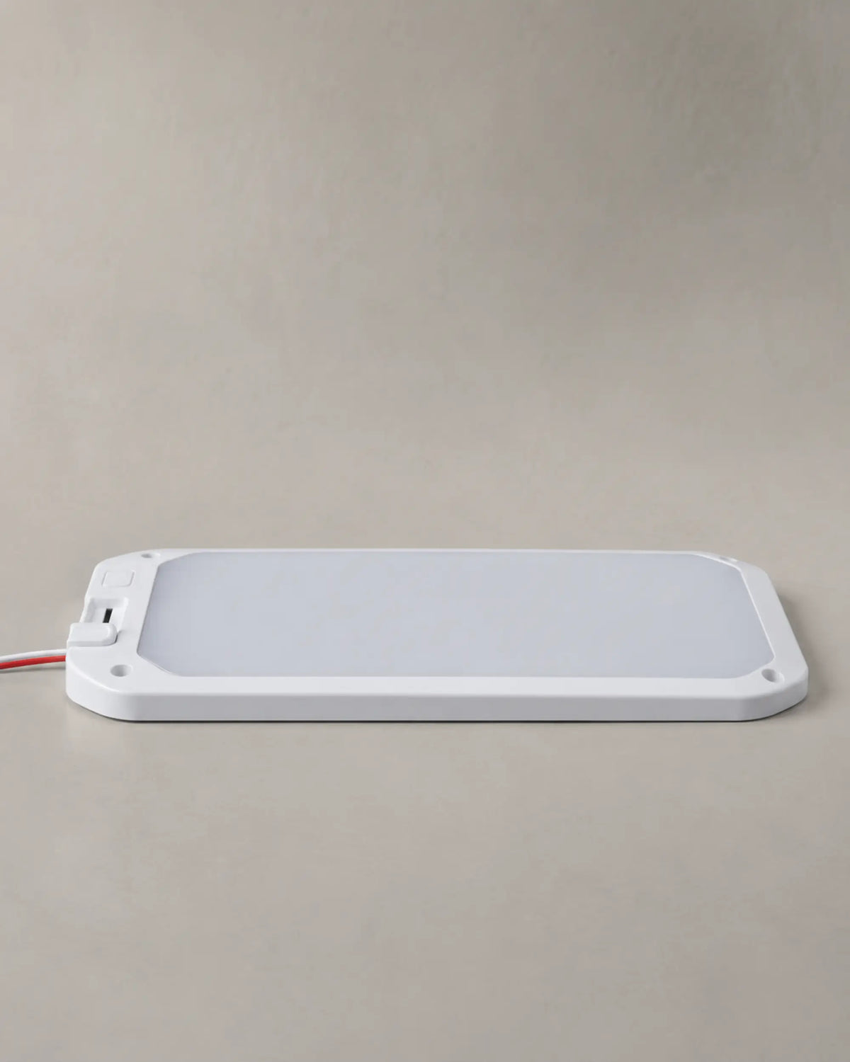 Slim side profile of the white dimmable RV ceiling light with power leads