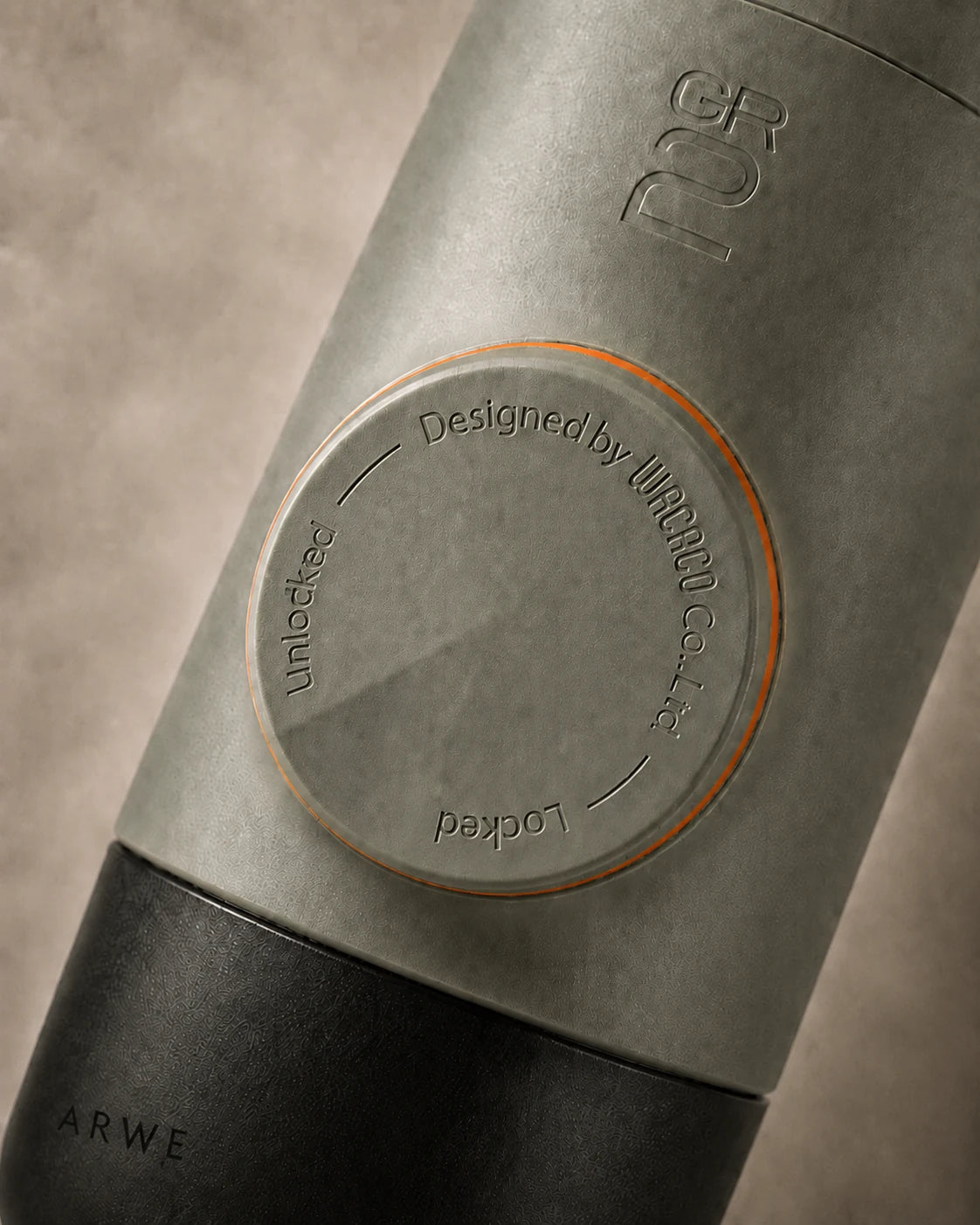 Close-up of WACACO Minipresso GR2 locking dial engraved with Designed by WACACO