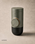 WACACO Minipresso GR2 espresso maker angled view in olive green showing locking dial